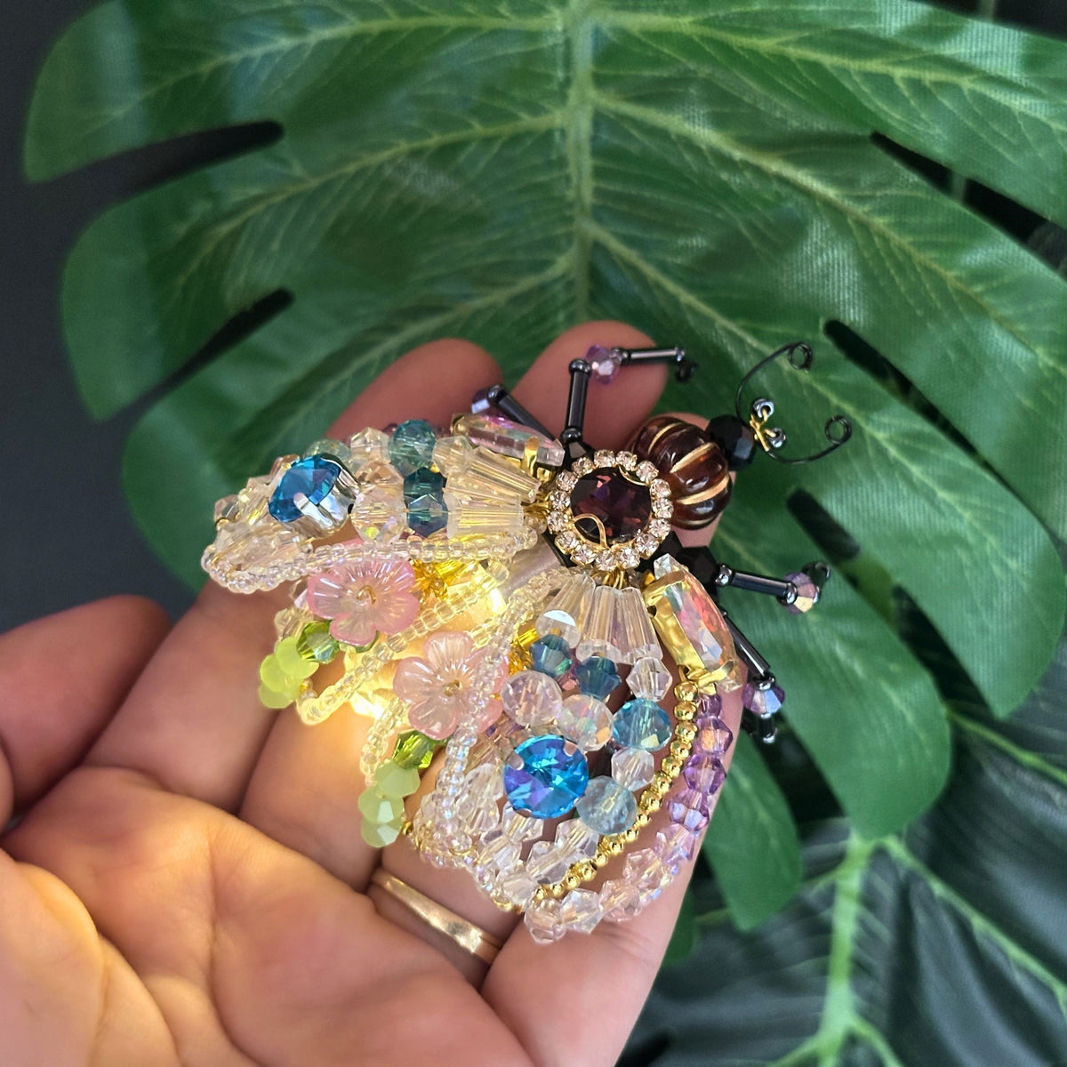 Finished beaded firefly suncatcher
