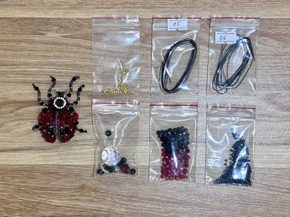 Ladybug Suncatcher DIY Kit - materials laid out
