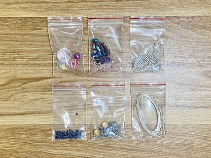 Christmas Spider Suncatcher DIY Kit - materials laid out (Christmas)