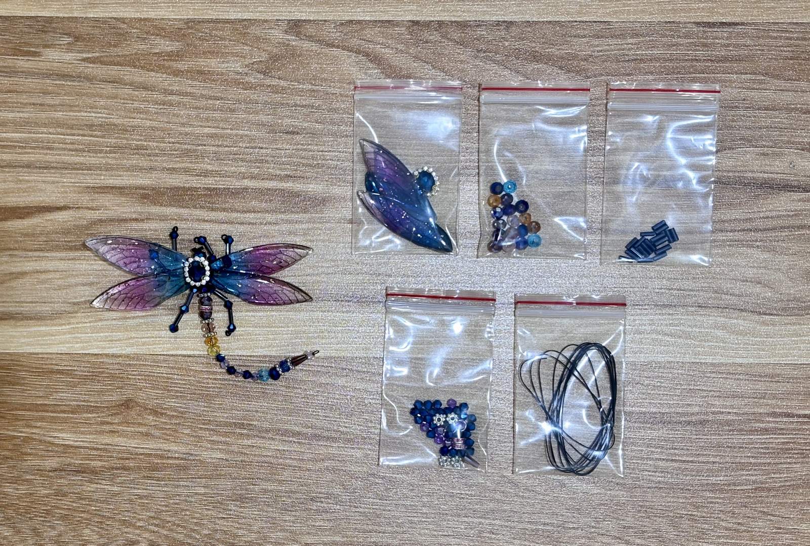 Dragonfly Suncatcher DIY Kit materials laid out - Blue