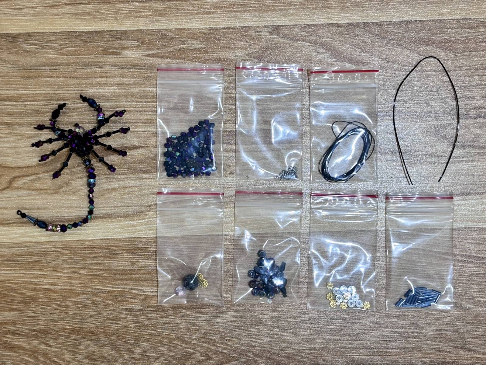 Scorpion Suncatcher DIY Kit - materials laid out (Purple)