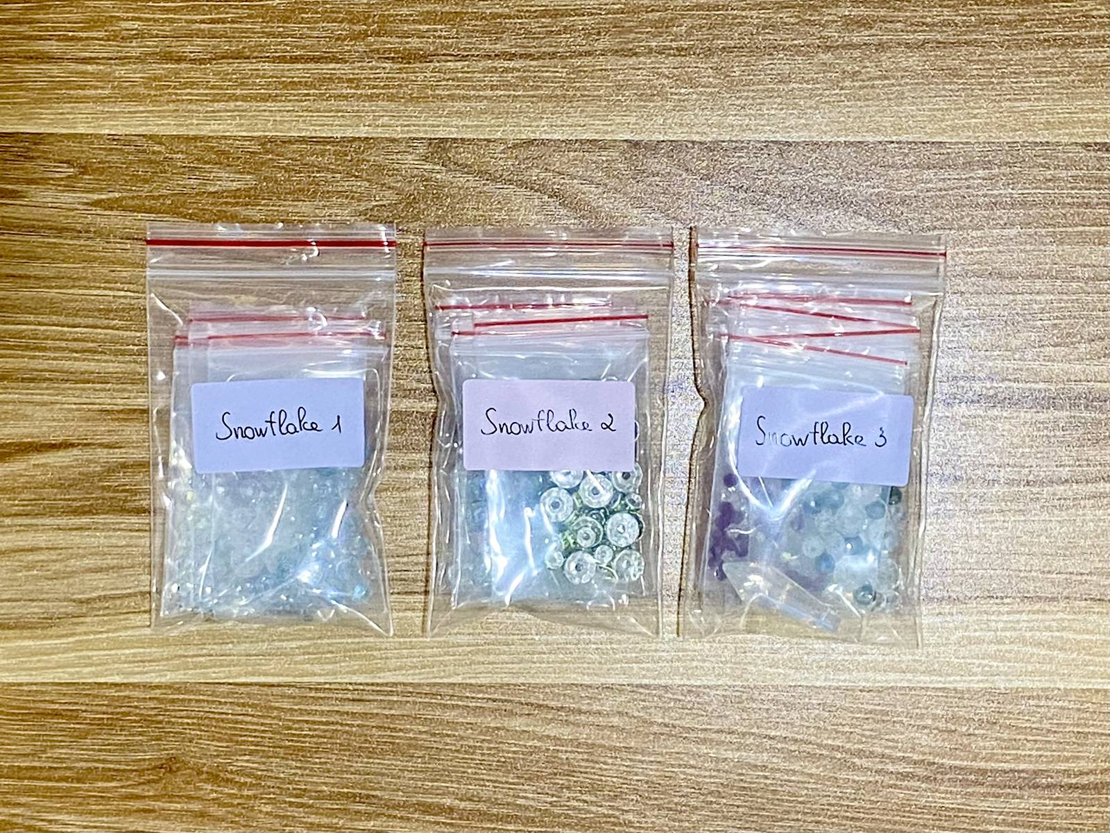 Snowflake Suncatcher DIY Kit - materials laid out (3-in-1 kit)