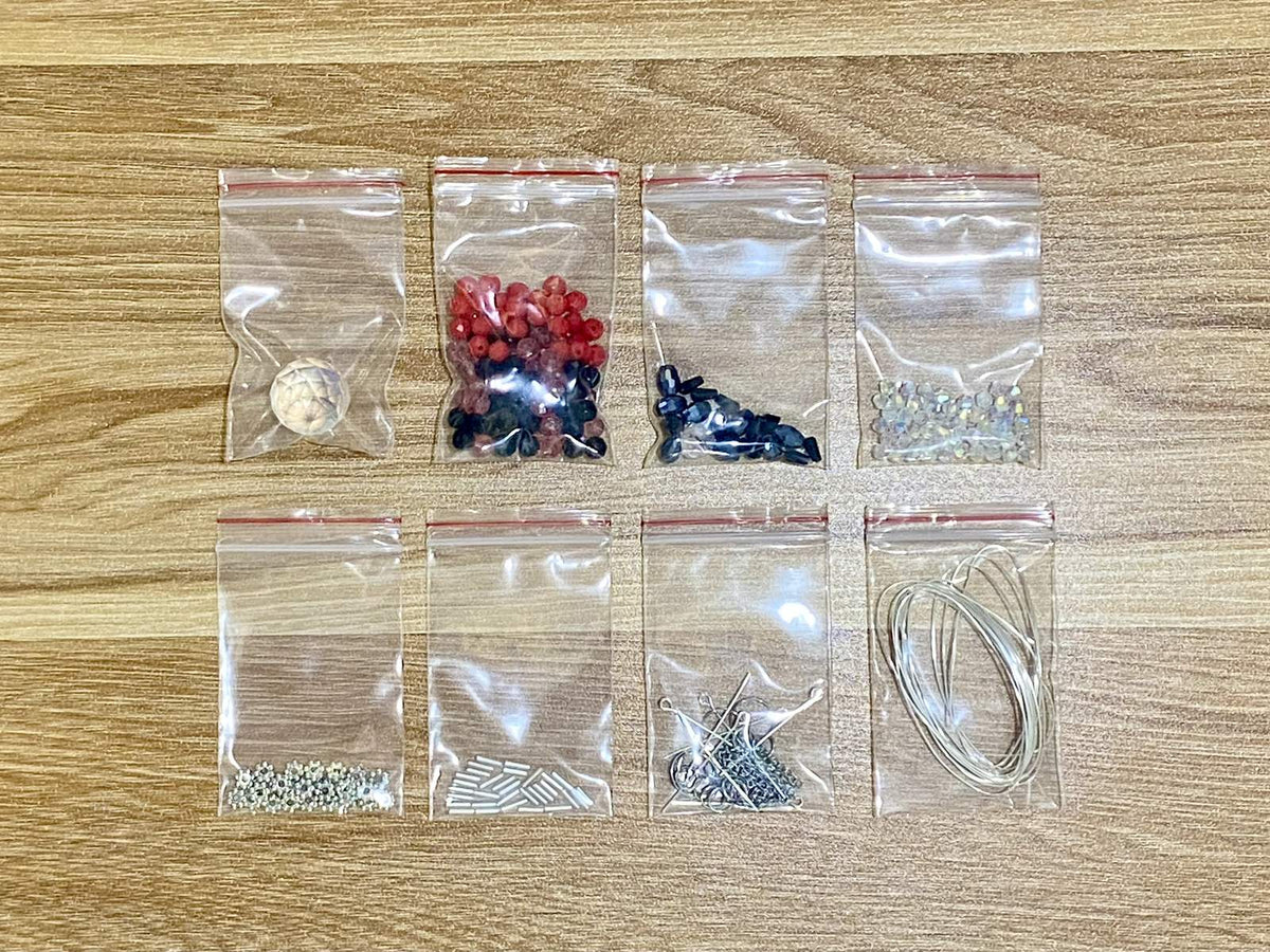Spider Suncatcher DIY Kit - materials laid out (Red)